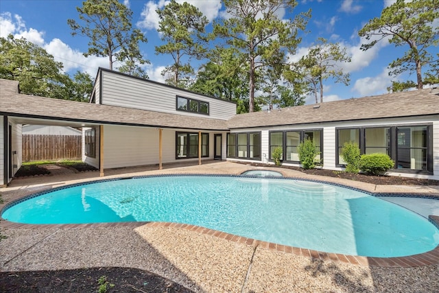 pool with fence and a patio area
