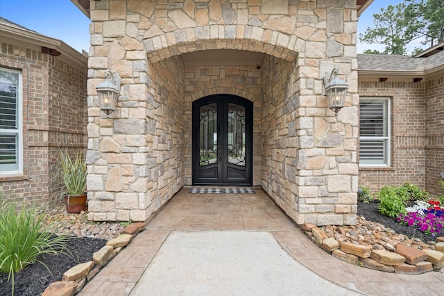 33026 Sawgrass Ct, Magnolia, TX 77354 - property entrance featuring french doors and stone siding