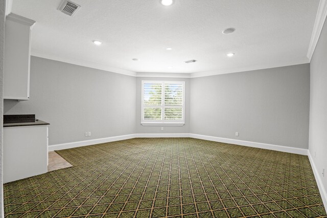 33026 Sawgrass Ct, Magnolia, TX 77354 - unfurnished living room featuring crown molding, recessed lighting, visible vents, and dark colored carpet