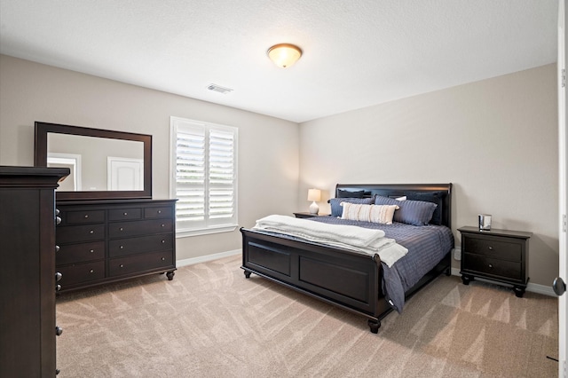 33026 Sawgrass Ct, Magnolia, TX 77354 - bedroom featuring baseboards, visible vents, and light carpet