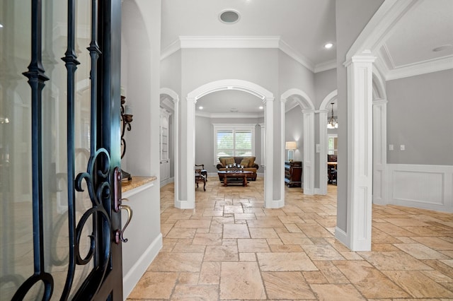 33026 Sawgrass Ct, Magnolia, TX 77354 - entrance foyer featuring stone tile flooring, arched walkways, and decorative columns