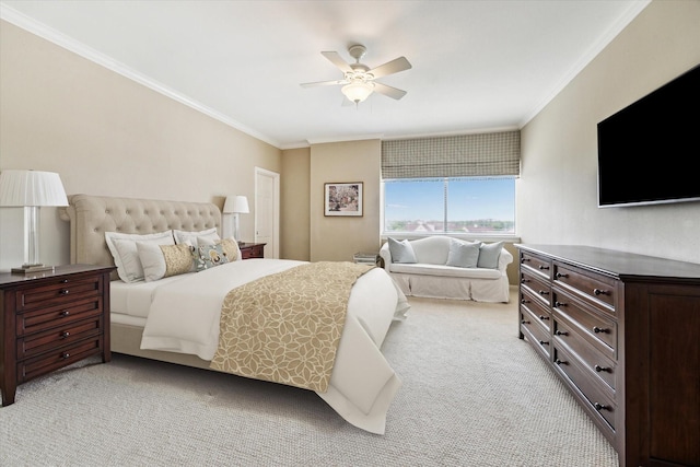 bedroom with ornamental molding, ceiling fan, and light colored carpet