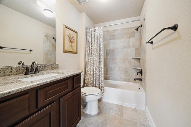 full bath with vanity, toilet, visible vents, and shower / bath combo with shower curtain