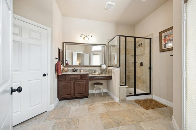 full bath with baseboards, a shower stall, and visible vents