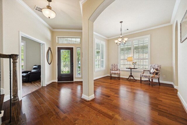 entrance foyer with crown molding, dark wood-style flooring, and visible vents