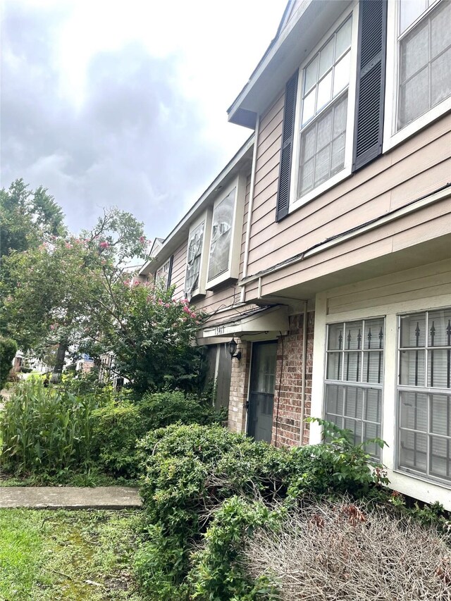view of home's exterior featuring brick siding