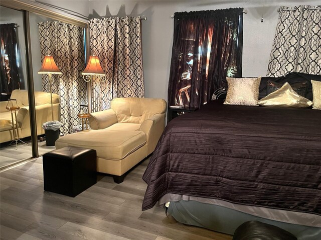 bedroom featuring wood finished floors