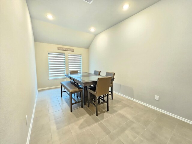 dining space with visible vents, lofted ceiling, light tile patterned flooring, baseboards, and recessed lighting