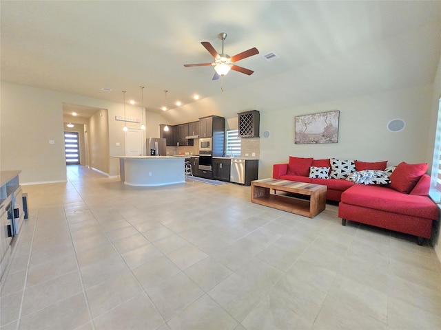 10422 Rigel Ridge Way, Richmond, TX 77406 - living room with lofted ceiling, light tile patterned floors, and ceiling fan