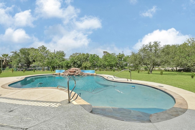 1004 8th St, San Leon, TX 77539 - pool featuring a lawn and a patio area