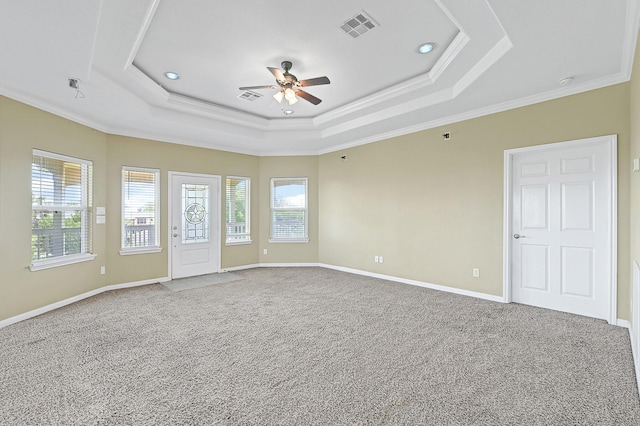 1004 8th St, San Leon, TX 77539 - unfurnished bedroom with a tray ceiling, crown molding, carpet flooring, and visible vents