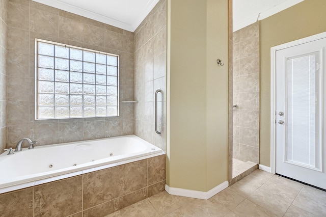 1004 8th St, San Leon, TX 77539 - bathroom with a whirlpool tub, baseboards, ornamental molding, a tile shower, and tile patterned floors