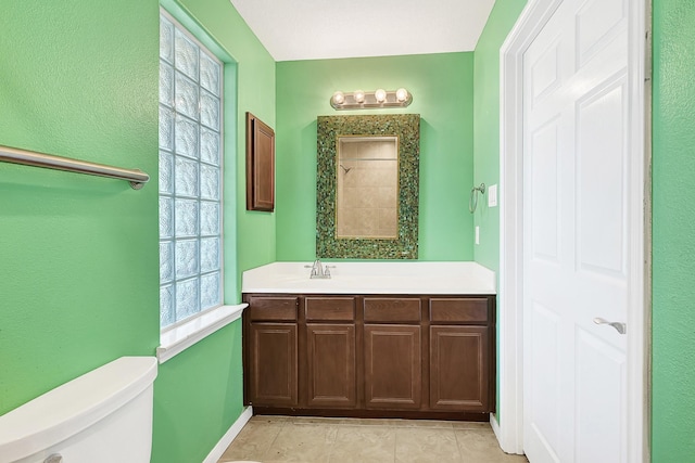 1004 8th St, San Leon, TX 77539 - full bathroom featuring toilet, baseboards, walk in shower, tile patterned flooring, and vanity
