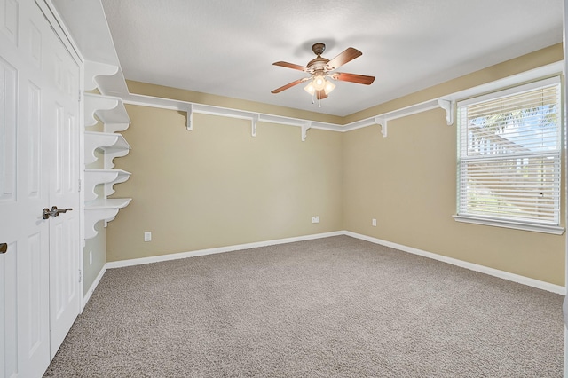 1004 8th St, San Leon, TX 77539 - empty room featuring ceiling fan, carpet, and baseboards