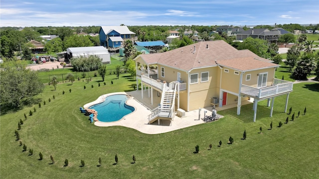 1004 8th St, San Leon, TX 77539 - back of house with a lawn, a patio, stairs, a deck, and a fenced backyard