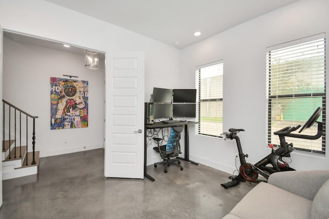 home office with finished concrete flooring, baseboards, and recessed lighting