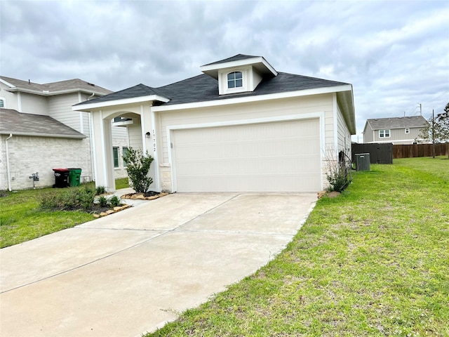 view of front of property featuring a front yard, a garage, central AC, fence, and concrete driveway