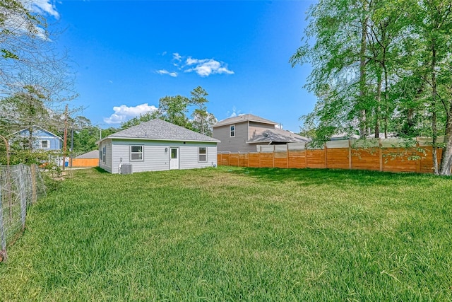 view of yard with a fenced backyard and cooling unit