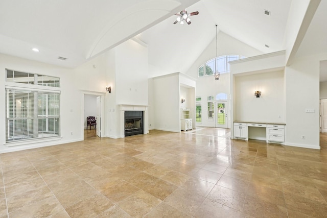 unfurnished living room featuring visible vents, a fireplace, baseboards, ceiling fan, and high vaulted ceiling