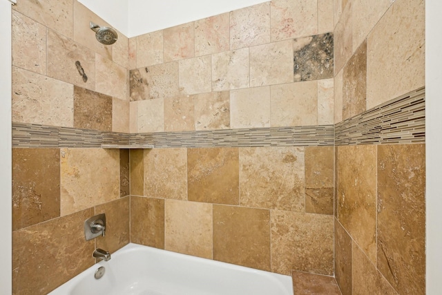 interior details with tub / shower combination