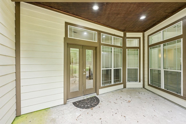 property entrance with french doors and a patio area