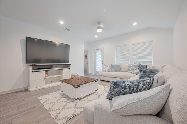 living area with light wood-type flooring, recessed lighting, baseboards, and visible vents
