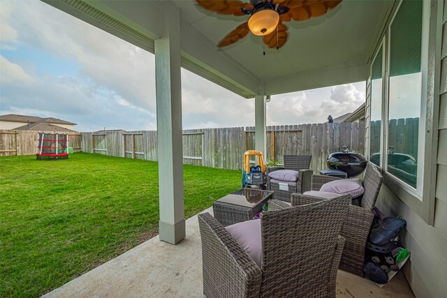 view of patio / terrace featuring a fenced backyard and a ceiling fan