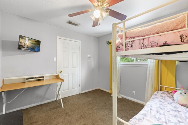 carpeted bedroom featuring visible vents, baseboards, and ceiling fan