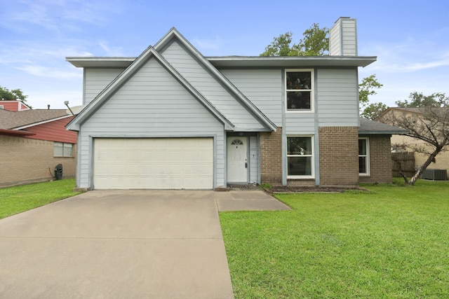 traditional home featuring a chimney, a front yard, a garage, brick siding, and concrete driveway