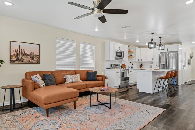 1747 Forest Hill Blvd, Houston, TX 77023 - living area with recessed lighting, dark wood finished floors, a ceiling fan, and baseboards