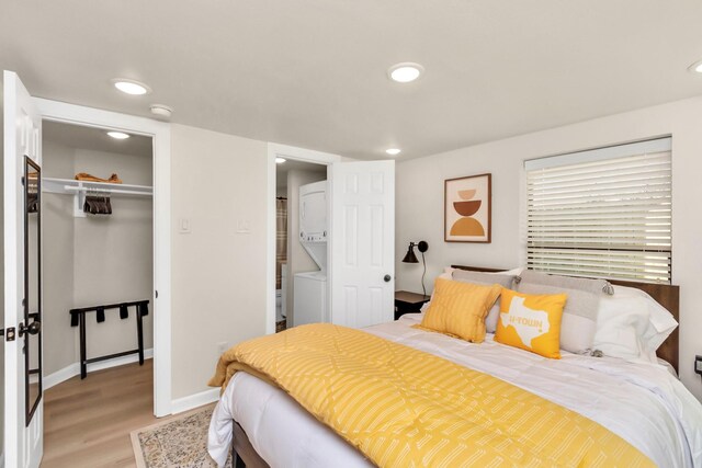 1747 Forest Hill Blvd, Houston, TX 77023 - bedroom featuring light wood-type flooring, a closet, baseboards, and recessed lighting