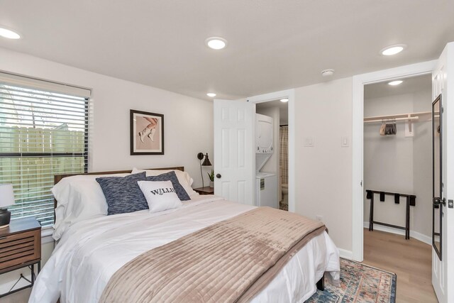 1747 Forest Hill Blvd, Houston, TX 77023 - bedroom with light wood-style floors, recessed lighting, a closet, a walk in closet, and baseboards