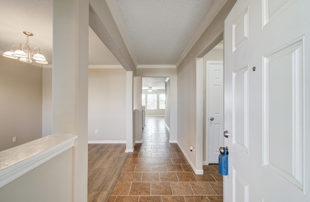 1211 Reedpoint Dr, Houston, TX 77090 - entrance foyer with crown molding, baseboards, stone finish floor, a textured ceiling, and ceiling fan with notable chandelier