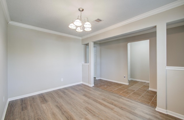 1211 Reedpoint Dr, Houston, TX 77090 - spare room with crown molding, wood finished floors, a chandelier, and visible vents