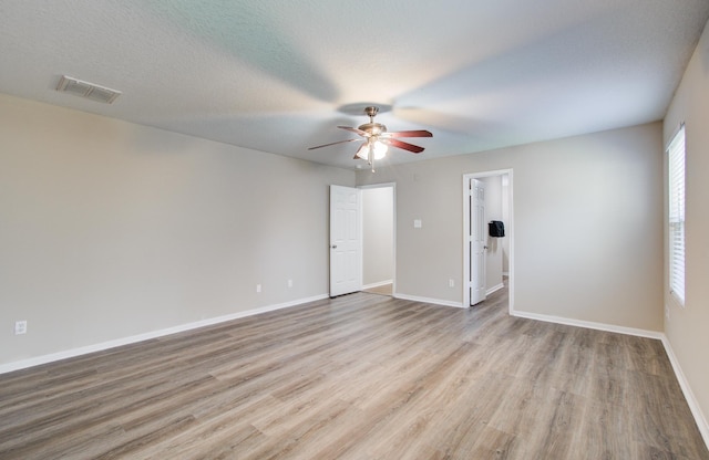 1211 Reedpoint Dr, Houston, TX 77090 - unfurnished room with baseboards, a ceiling fan, wood finished floors, and visible vents