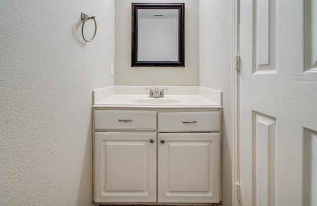 1211 Reedpoint Dr, Houston, TX 77090 - bathroom with vanity and a textured wall