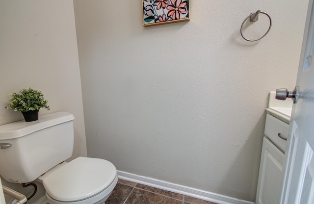 1211 Reedpoint Dr, Houston, TX 77090 - bathroom featuring toilet, baseboards, and vanity