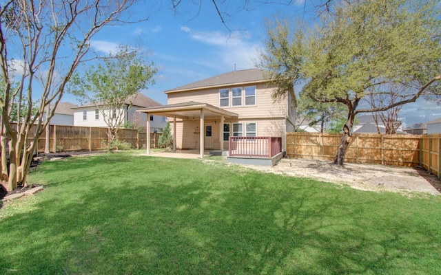 1211 Reedpoint Dr, Houston, TX 77090 - back of property featuring a yard, a fenced backyard, and a patio area
