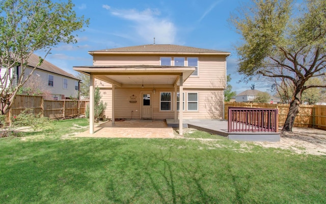 1211 Reedpoint Dr, Houston, TX 77090 - back of house featuring a fenced backyard, a patio, a lawn, and a deck