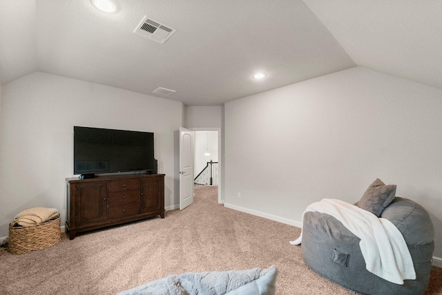living area featuring visible vents, recessed lighting, carpet flooring, vaulted ceiling, and an upstairs landing