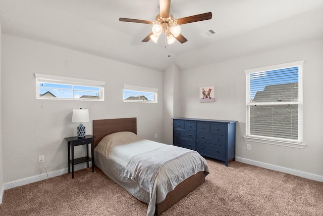 bedroom featuring baseboards, light carpet, and visible vents