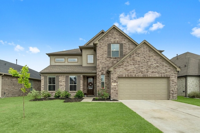 view of front of property featuring roof with shingles, concrete driveway, a front yard, and brick siding