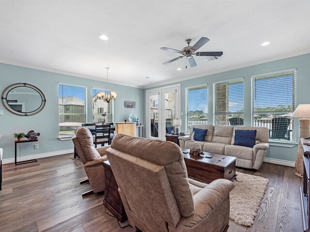 living room with crown molding and plenty of natural light