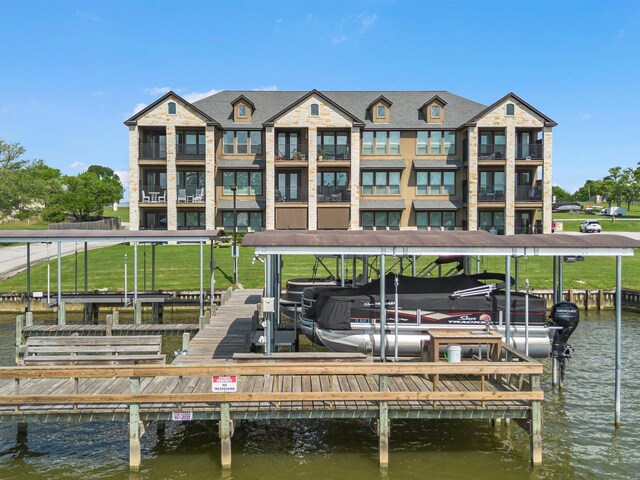view of dock featuring a water view and boat lift
