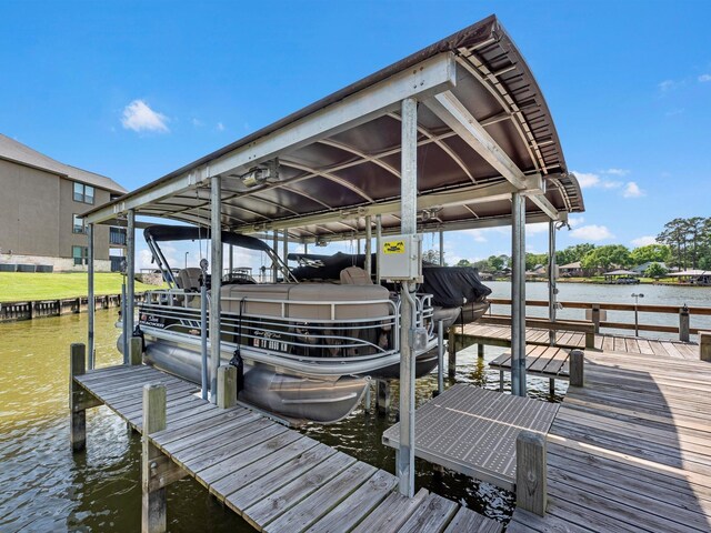 view of dock featuring a water view and boat lift