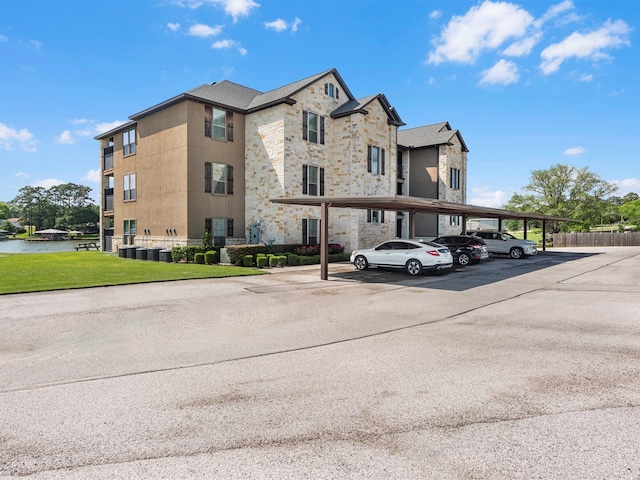 2112 Fm 3186 Unit C4, Onalaska, TX 77360 - view of building exterior with covered parking and fence