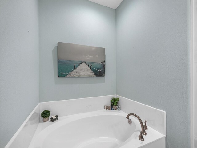 full bathroom with a garden tub