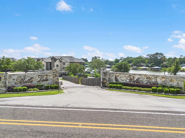 2112 Fm 3186 Unit C4, Onalaska, TX 77360 - community sign featuring a water view, fence, a gate, and a residential view
