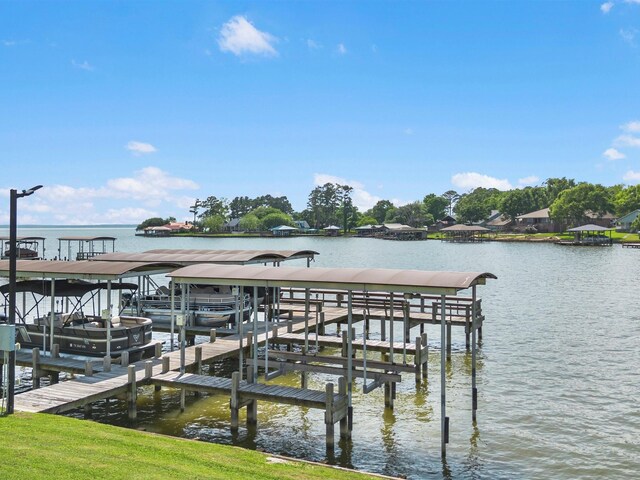 view of dock with a water view and boat lift