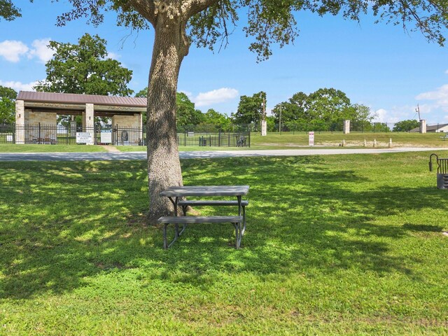 2112 Fm 3186 Unit C4, Onalaska, TX 77360 - view of property's community featuring a yard and fence